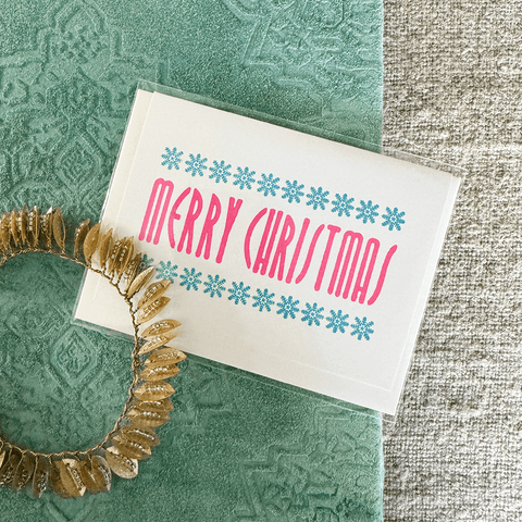 Greeting Card 'Pink Merry Christmas with Light Blue Snowflakes' by Cold Ash Press - Curated Living